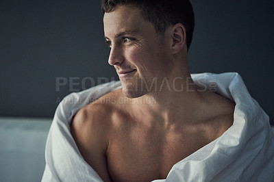 Buy stock photo Cropped shot of a shirtless young man relaxing in his bedroom