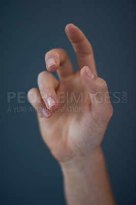 Buy stock photo Studio shot of an unrecognizable man's hand against a blue background