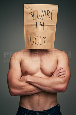 Buy stock photo Shot of an unrecognizable man wearing a paper bag saying 
