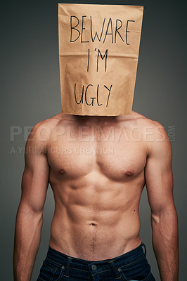 Buy stock photo Shot of an unrecognizable man wearing a paper bag saying 