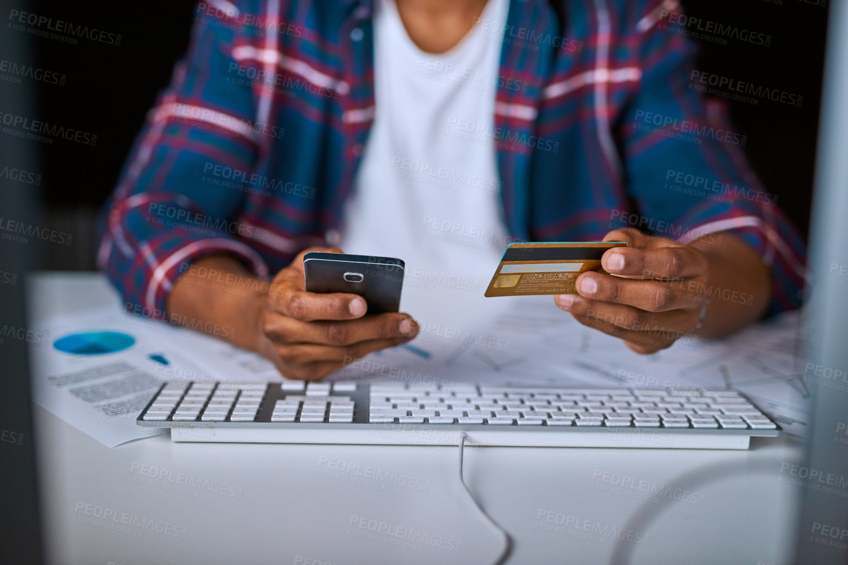 Buy stock photo Cropped shot of an unrecognizable man doing online banking using his cellphone