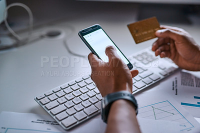 Buy stock photo High angle shot of an unrecognizable man doing online banking using his cellphone