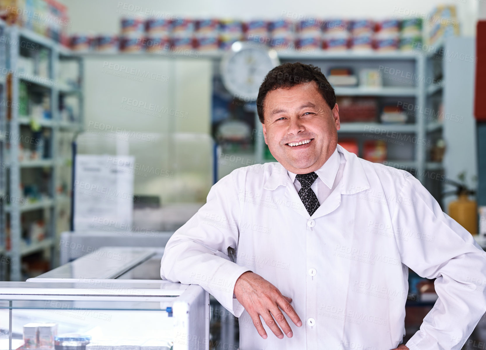 Buy stock photo Portrait of a male pharmacist in a pharmacy