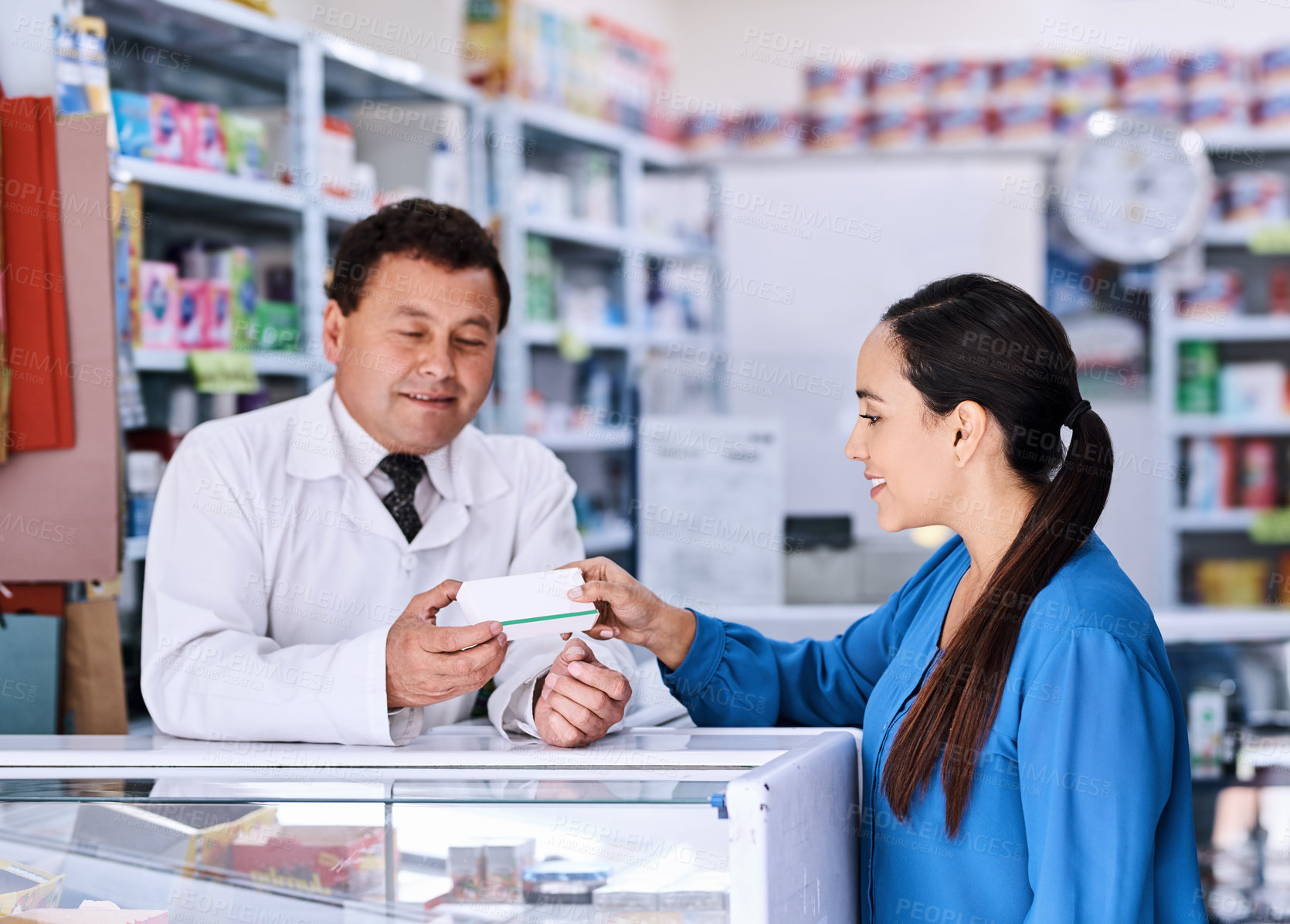 Buy stock photo Pharmacist, man and customer with pills, prescription and healthcare advice for drugs. Discussion, medical and wellness help talk with instructions, care and medicine at counter in hospital pharmacy