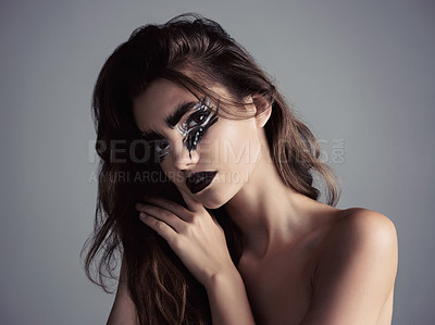 Buy stock photo Studio shot of an attractive young woman wearing bold makeup
