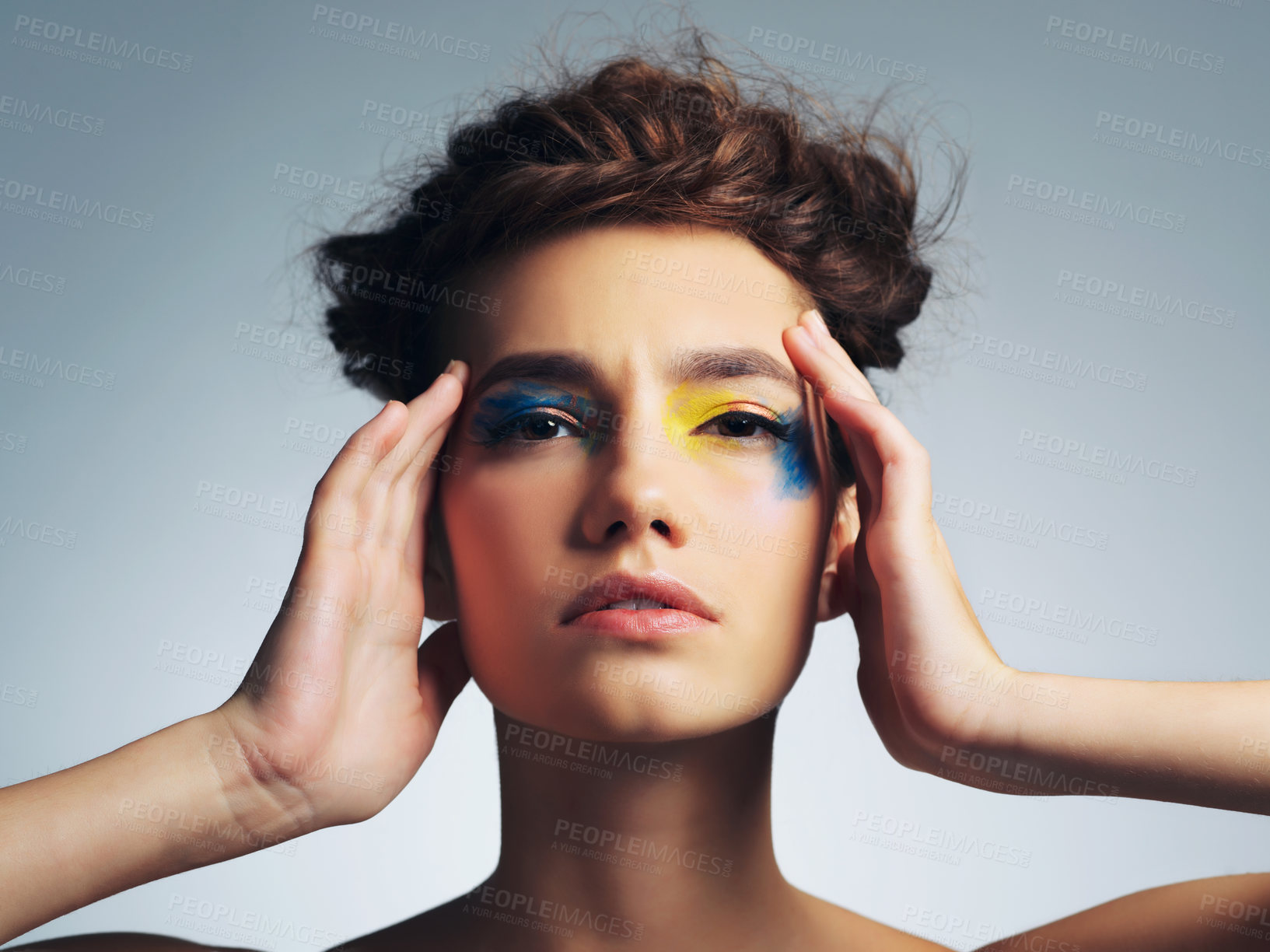 Buy stock photo Woman, paint and colorful eyeshadow in studio, creative makeup and skincare on gray background. Female person, character and confident with abstract aesthetic, unique and art in beauty cosmetics