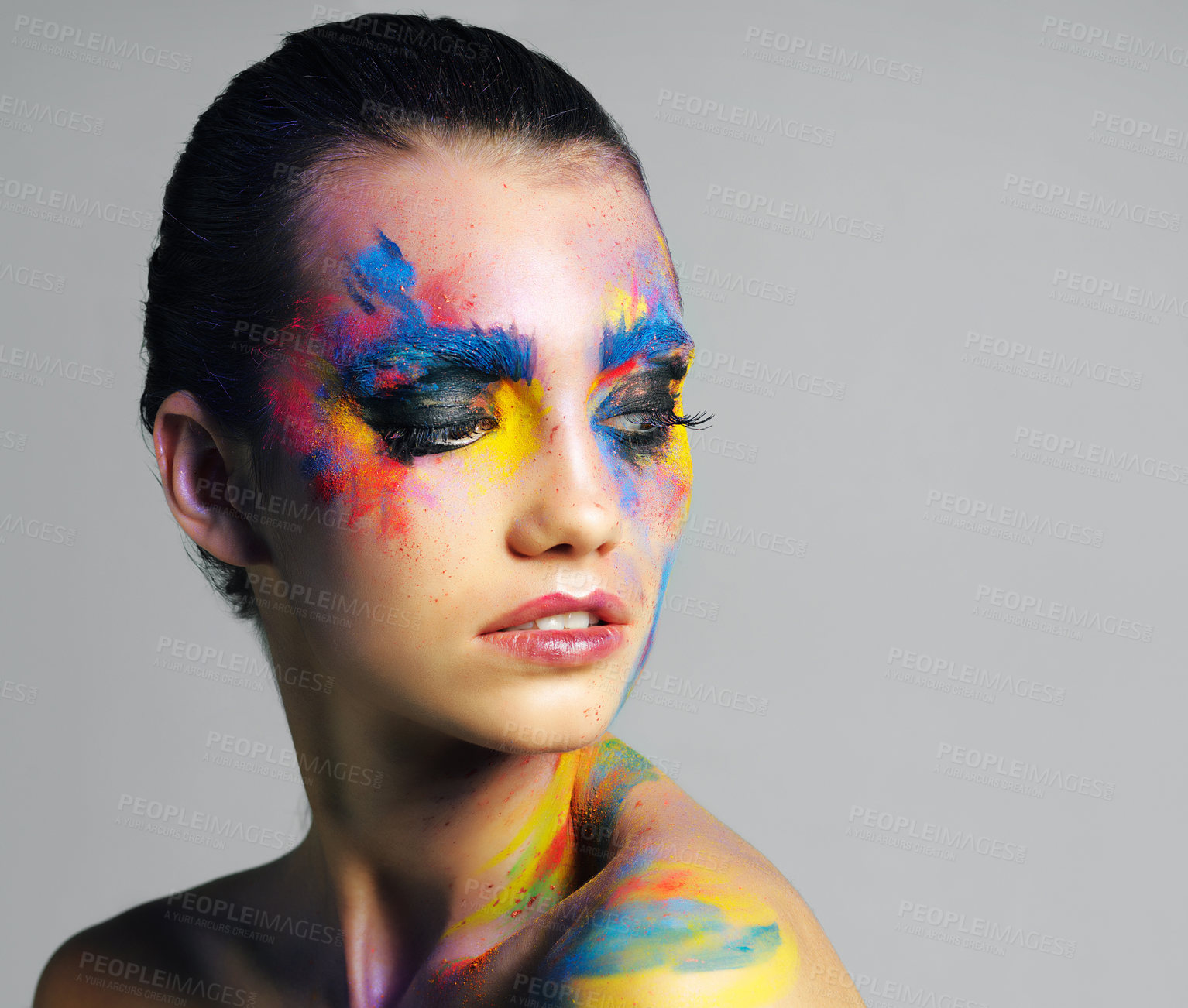 Buy stock photo Face paint, thinking and beauty of woman in makeup isolated on gray studio background. Creative, art and young model with color cosmetics on skin for abstract, fantasy or aesthetic of rainbow