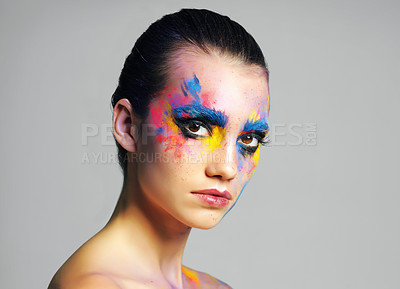 Buy stock photo Face paint, portrait and woman in makeup in studio isolated on gray background. Creative beauty, art and young model with color cosmetics for abstract, fantasy and glow of skincare with confidence