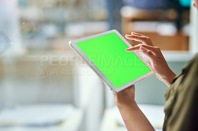 Buy stock photo Shot of an unrecognizable businesswoman using a tablet at the office