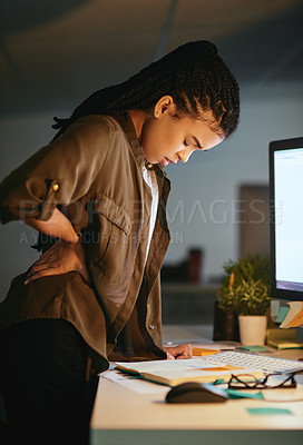 Buy stock photo Shot of a young businesswoman experiencing body discomfort at the office