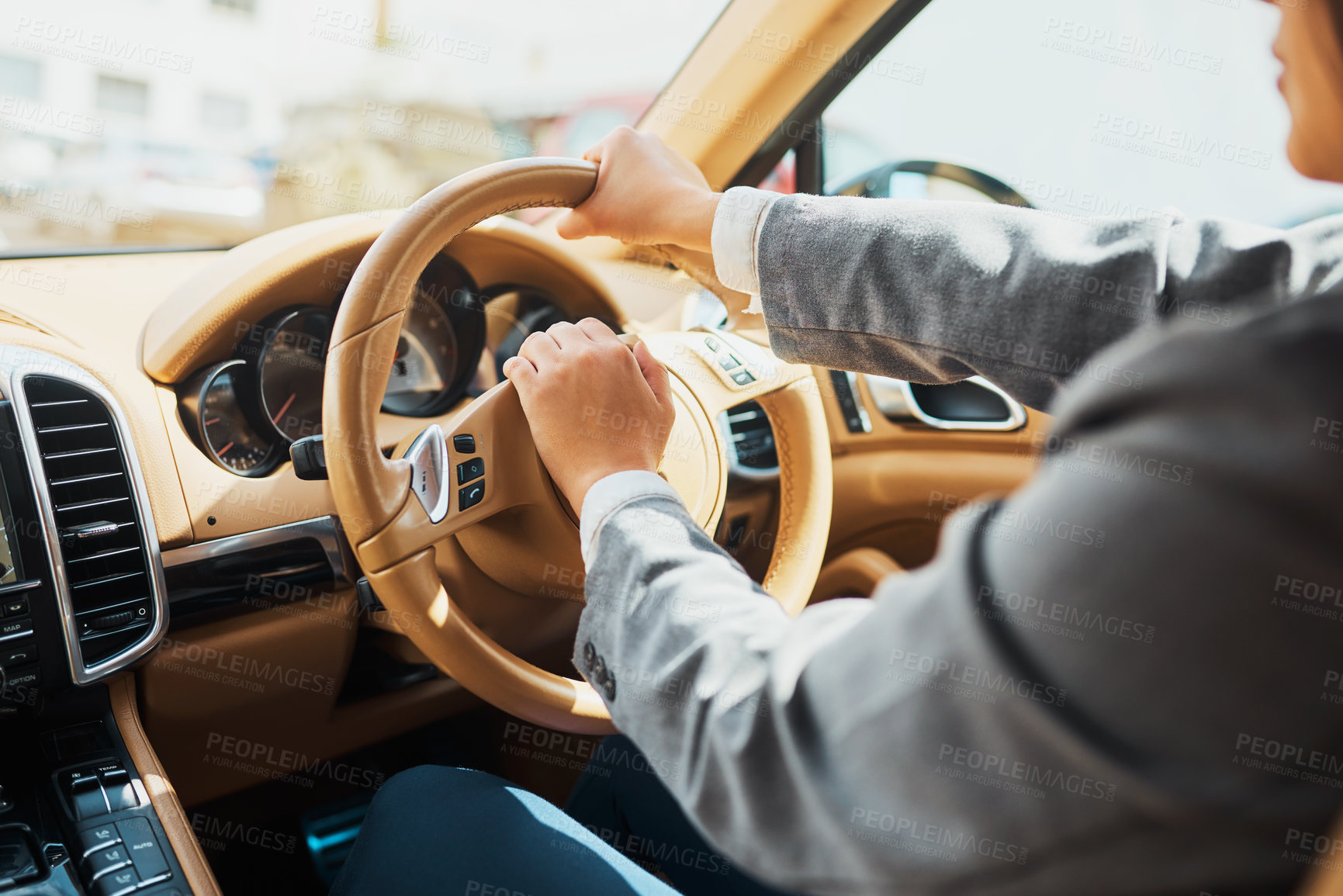 Buy stock photo Cropped shot of an unrecognizable businesswoman driving her car