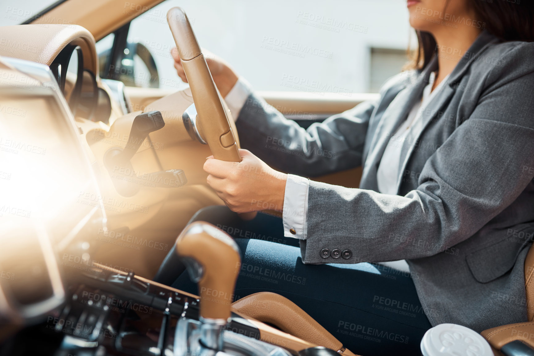 Buy stock photo Cropped shot of an unrecognizable businesswoman driving her car