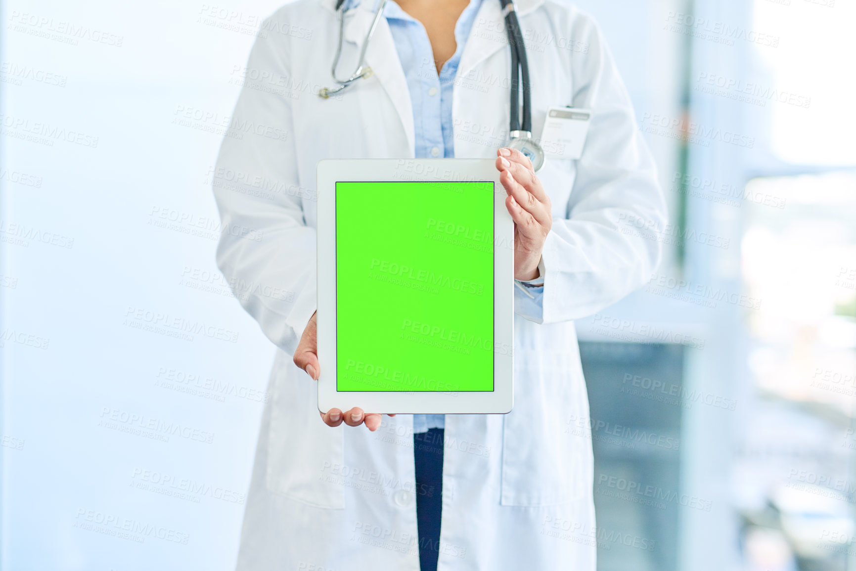 Buy stock photo Closeup shot of an unrecognizable doctor holding a digital tablet with a chroma key screen