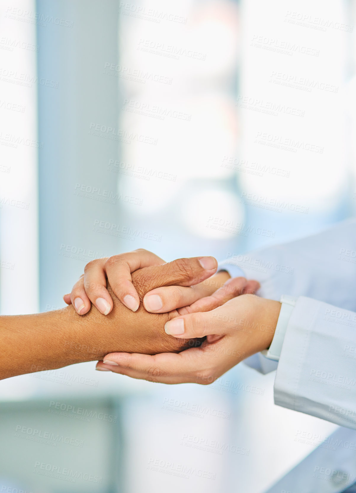 Buy stock photo Closeup shot of an unrecognizable doctor holding a patient's hand in comfort