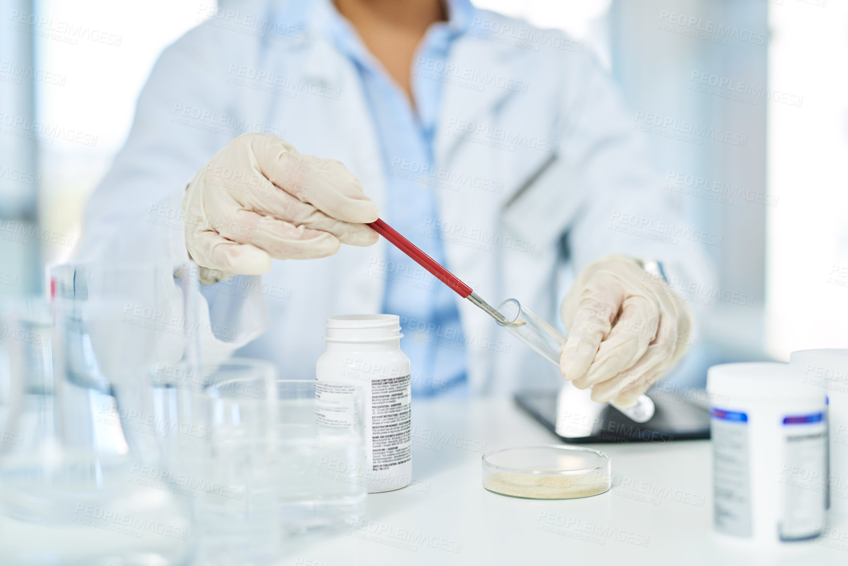 Buy stock photo Closeup shot of an unrecognizable scientist working in a lab