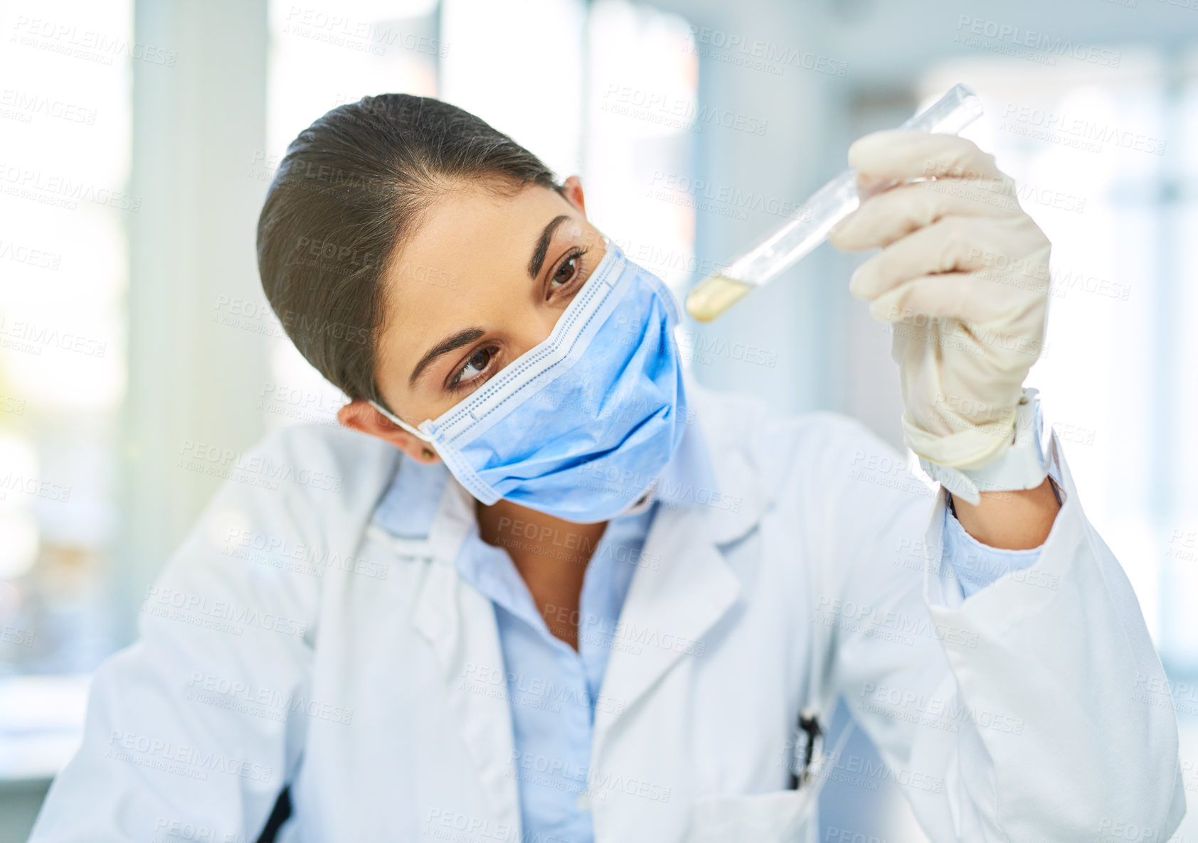 Buy stock photo Lab, face mask and woman scientist with test tube, solution or pharmaceutical vaccine development. Healthcare, science and person checking medical drugs for research, process or study in clinic.