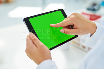 Buy stock photo Closeup shot of an unrecognizable scientist using a digital tablet with a chroma key screen in a lab