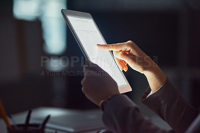 Buy stock photo Cropped shot of an unrecognizable businesswoman using a tablet in the office
