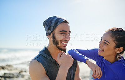 Buy stock photo Shot of two young cheerful friends hanging out together before a fitness exercise outside during the day