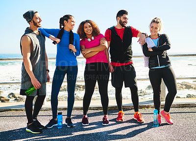 Buy stock photo Portrait of a cheerful young group of friends standing together before a fitness exercise outside during the day