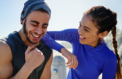 Buy stock photo Shot of two young cheerful friends hanging out together before a fitness exercise outside during the day