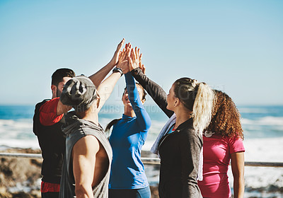 Buy stock photo Cropped shot of a fitness group high-fiving before a run