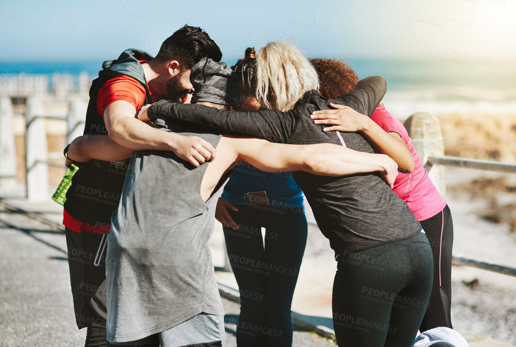 Buy stock photo Shot of a fitness group motivating each other before a run