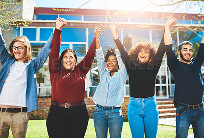 Buy stock photo Cropped portrait of a diverse group of college friends standing outside with their arms raised