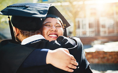 Buy stock photo Cropped shot of a young woman embracing her male friend after graduating