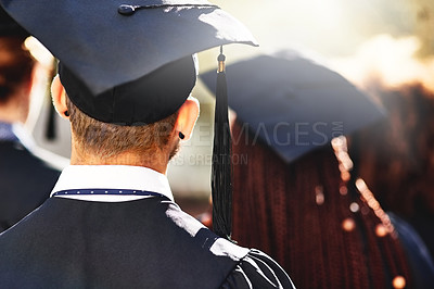 Buy stock photo Graduation cap, back and students at university ceremony on campus for education, opportunity and achievement. College, scholarship and group of people at event with knowledge, learning and progress