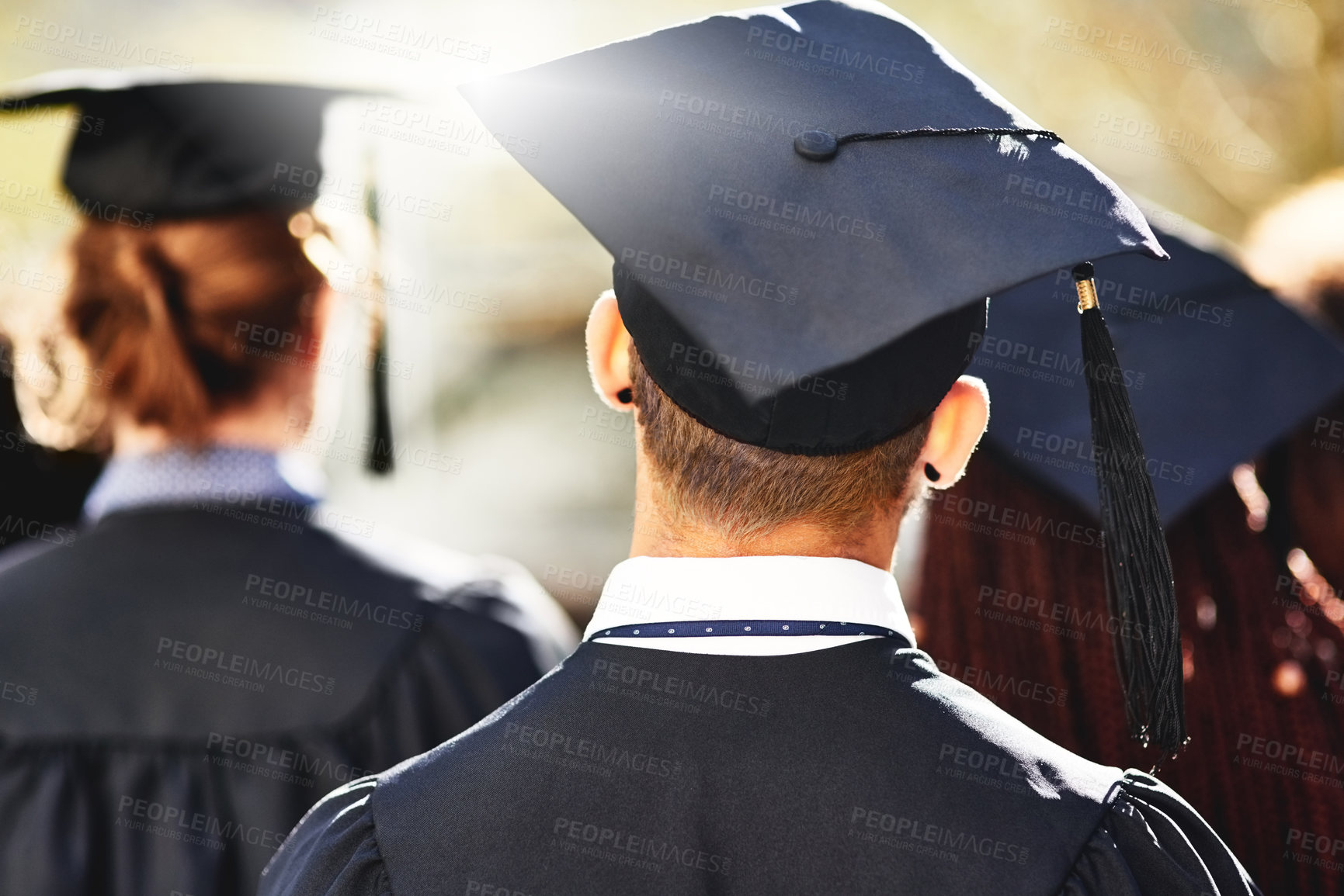 Buy stock photo Rearview shot of students on graduation day