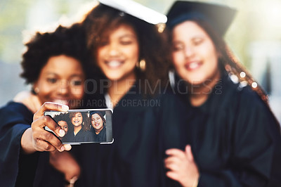 Buy stock photo Phone, students and graduation selfie for success, photography or celebration memory at campus. Hands, graduates or group of women with picture for social media, achievement or ceremony at university