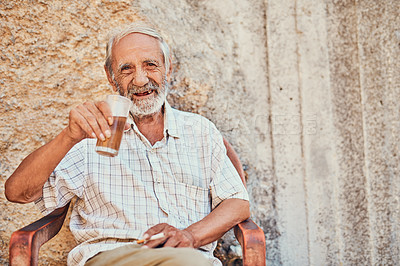 Buy stock photo Portrait, senior man and drinking beer in home, front porch or ancient architecture on wall. Pensioner, male person and comfort in retirement for beverage, alcohol and relax for elderly care in Italy