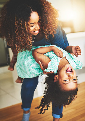 Buy stock photo Shot of a little girl and her mother dancing at home