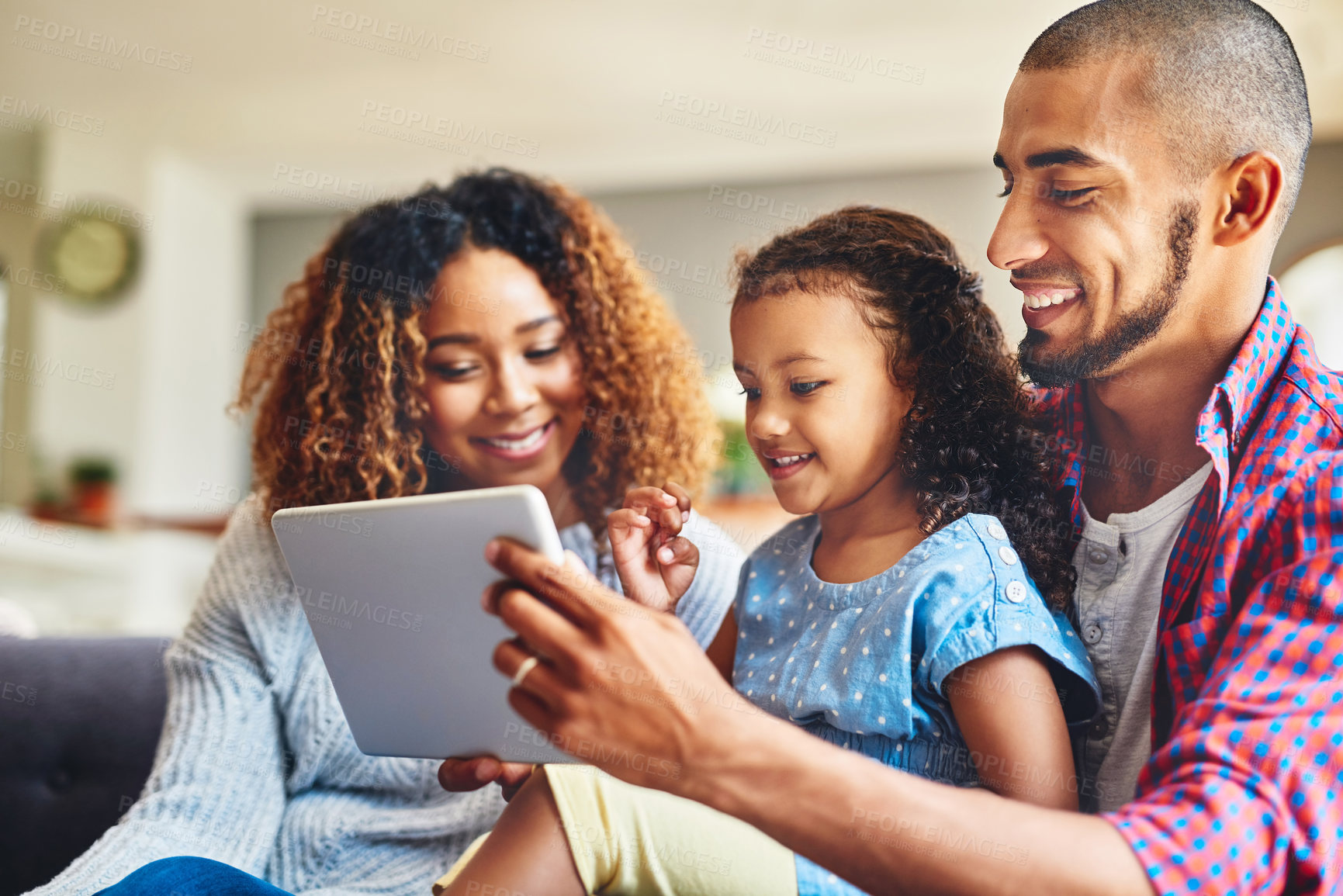 Buy stock photo Tablet, happy family and girl with parents in home together for learning, education or relax. Kid, mom and father on digital technology to watch movie, cartoon or streaming video on living room sofa