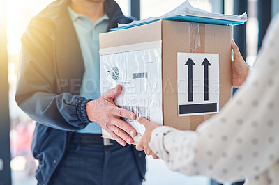 Buy stock photo Cropped shot of an unrecognizable delivery man handing a package to a female customer