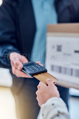 Buy stock photo Cropped shot of an unrecognizable delivery man receiving payment from a female customer for her order