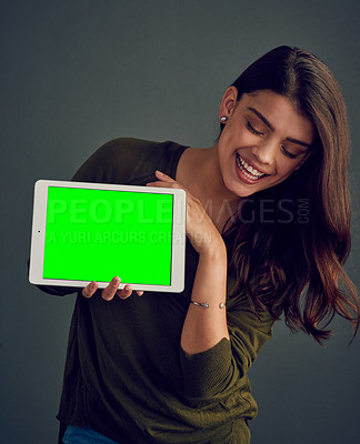 Buy stock photo Woman, tablet and happy in studio with green screen, mock up space and promo by dark background. Person, girl and model with digital touchscreen, chromakey and blank ux for application for connection