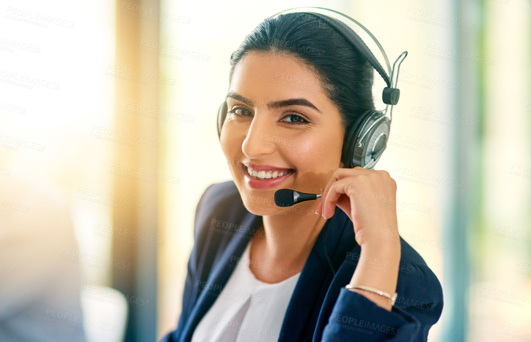 Buy stock photo Cropped portrait of an attractive young female customer care agent at work in her office
