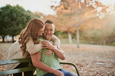 Buy stock photo Shot of an affectionate young couple in the countryside