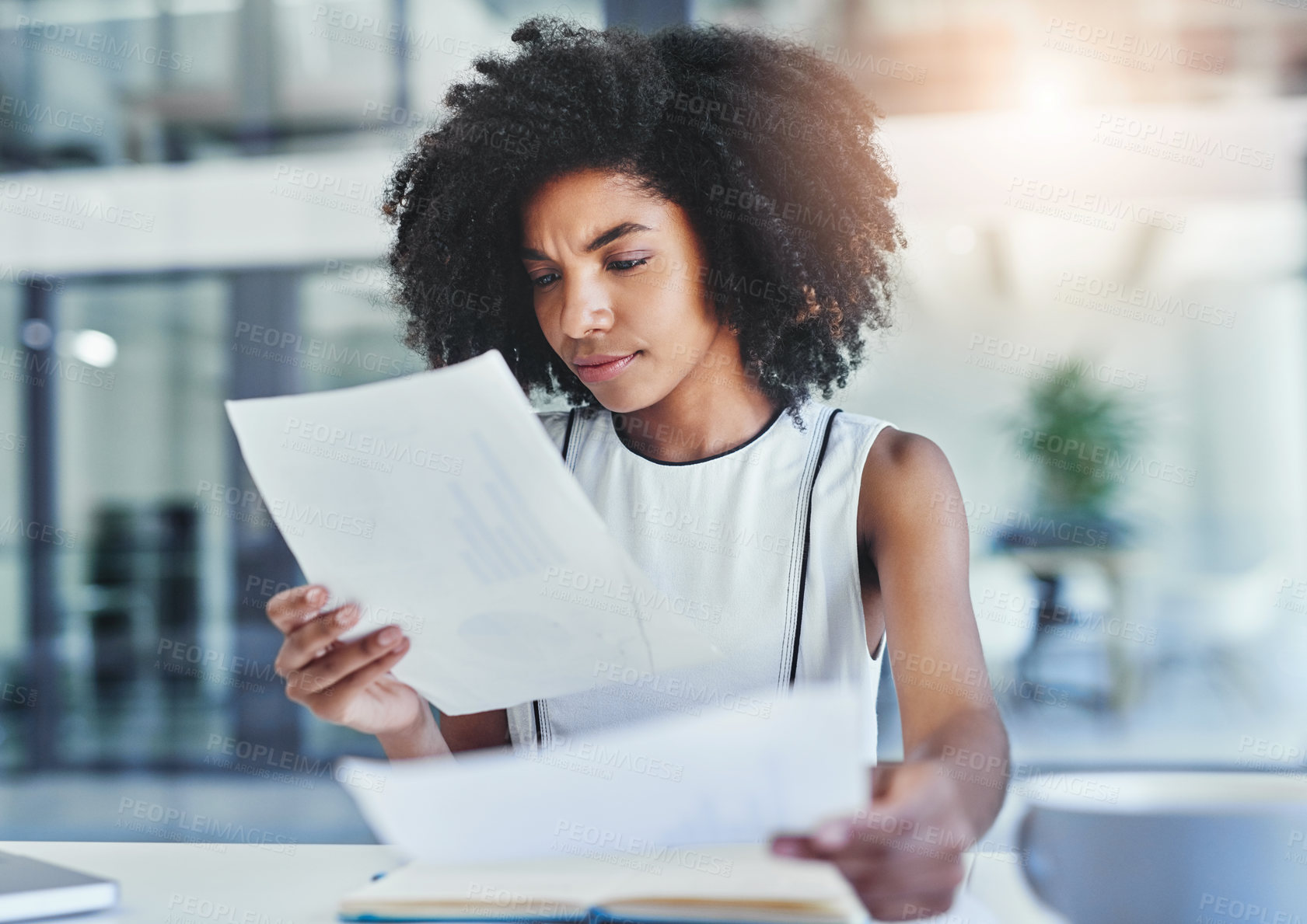 Buy stock photo Cropped shot of an attractive young businesswoman working in her office