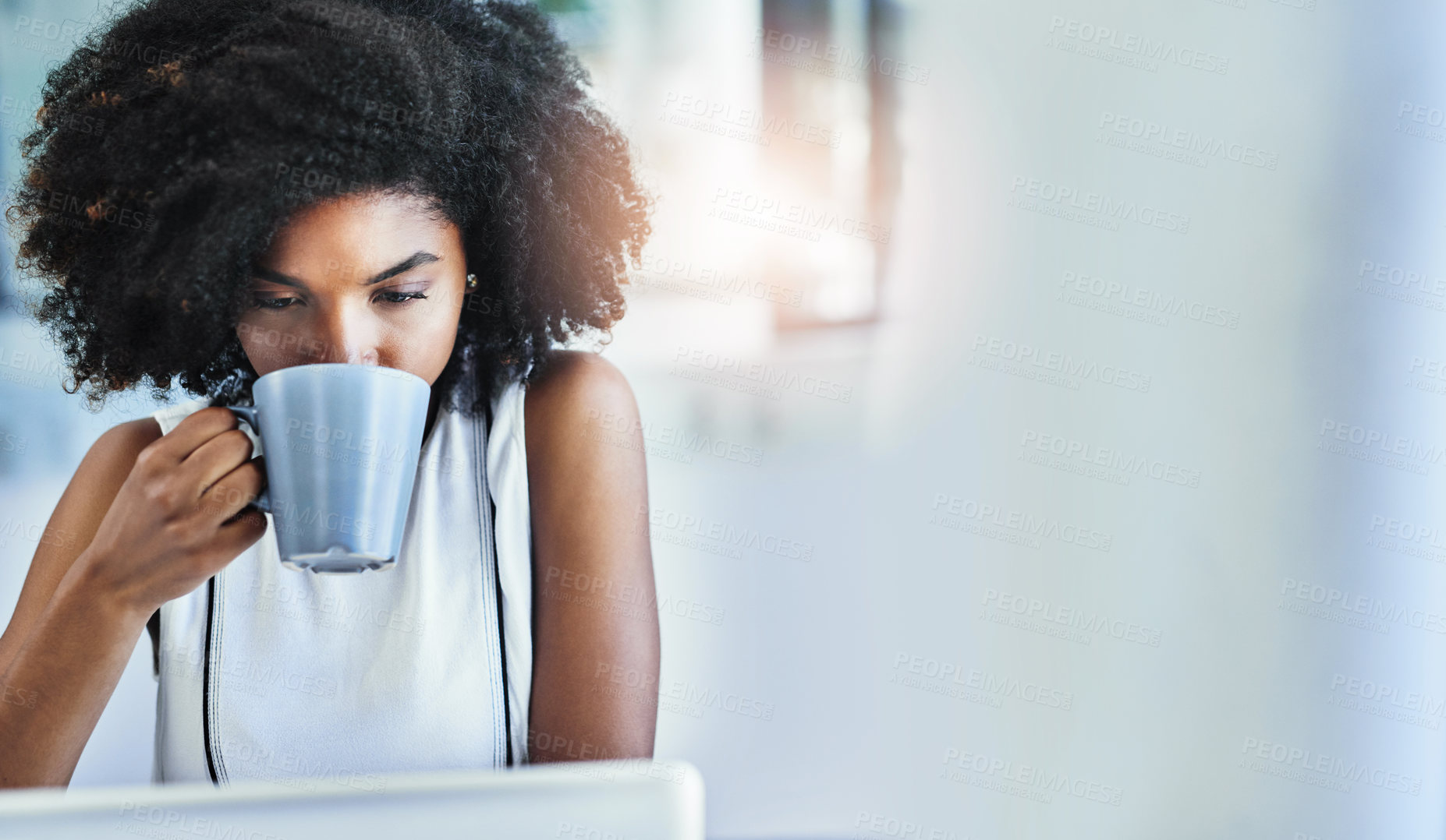Buy stock photo Cropped shot of an attractive young businesswoman drinking a cup of coffee in her office