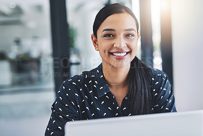 Buy stock photo Cropped shot of an attractive young businesswoman in her office 