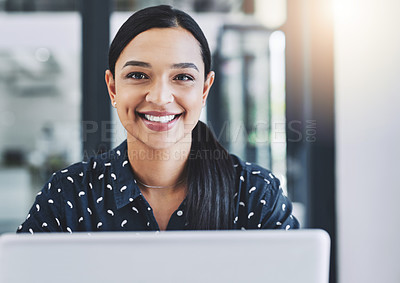 Buy stock photo Cropped shot of an attractive young businesswoman in her office 