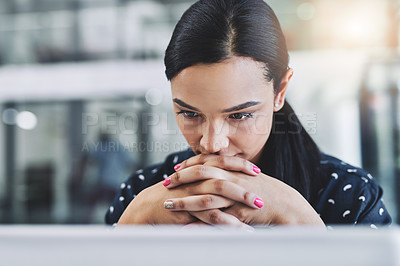 Buy stock photo Cropped shot of an attractive young businesswoman in her office 