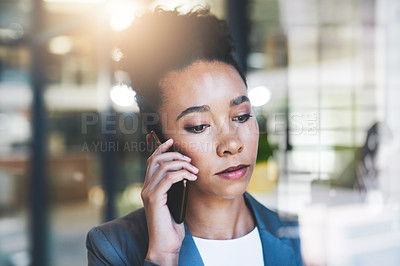 Buy stock photo Cropped shot of an attractive young businesswoman on a call in her office