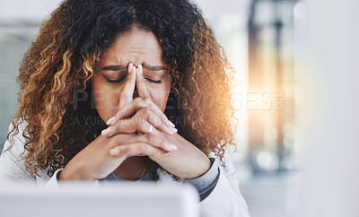 Buy stock photo Shot of a young businesswoman looking stressed out in an office