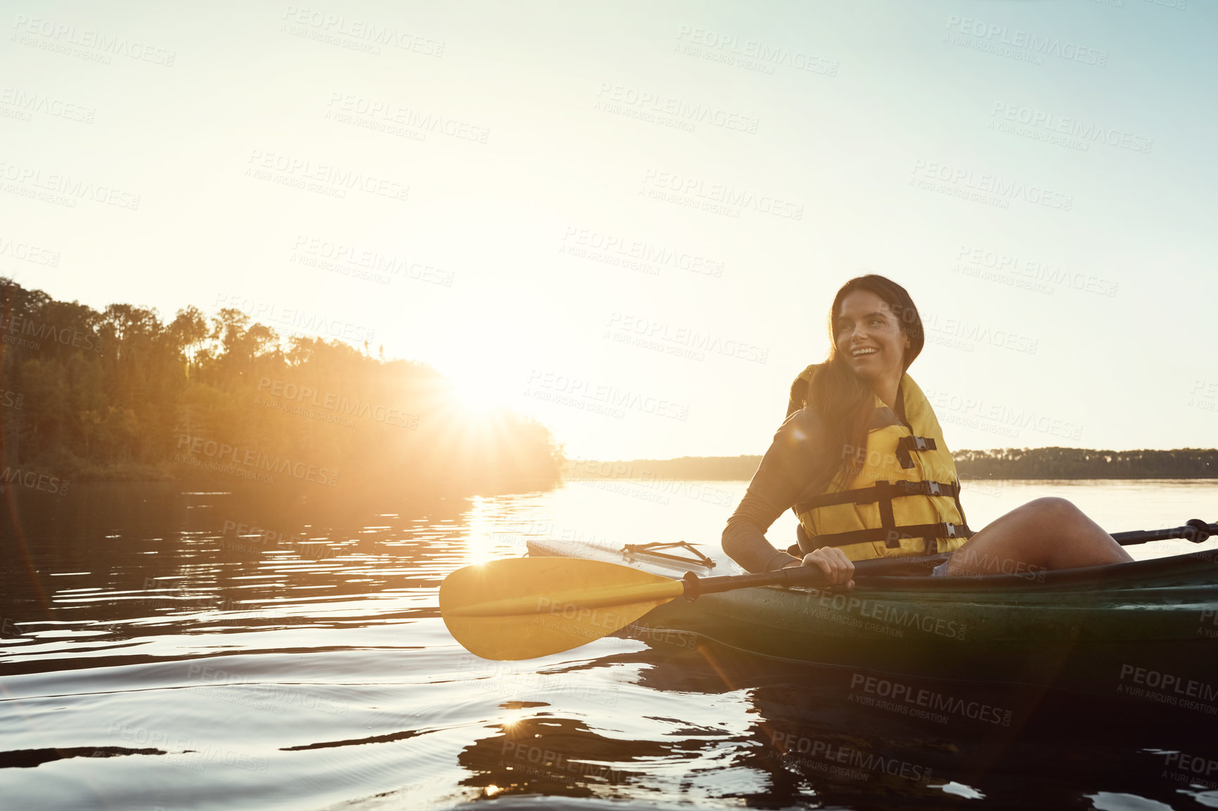 Buy stock photo Happy woman, canoeing and relax with paddle on ocean sunset for travel, hobby or outdoor journey in water, lake or nature. Female person rowing boat with smile for sunshine adventure, kayak or sea