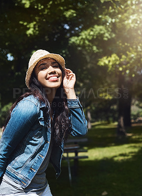 Buy stock photo Portrait of an attractive young woman spending a day in the park