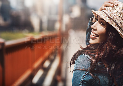 Buy stock photo Shot of a beautiful young woman spending her day in the city